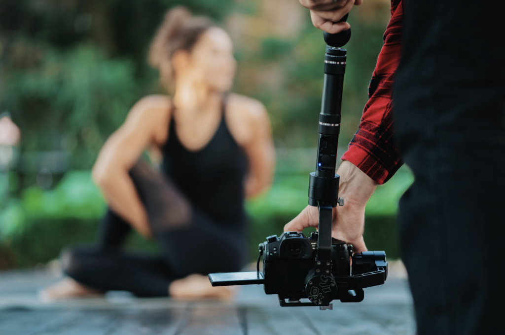 Person performing yoga for video